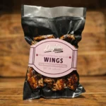 أجنحة دجاج مشوية بالكامل على الفحم ( الوزن نصف كيلو قبل التسوية)